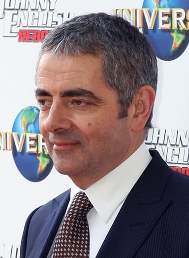 What was the name of the character Rowan Atkinson played in the James Bond film Never Say Never Again?