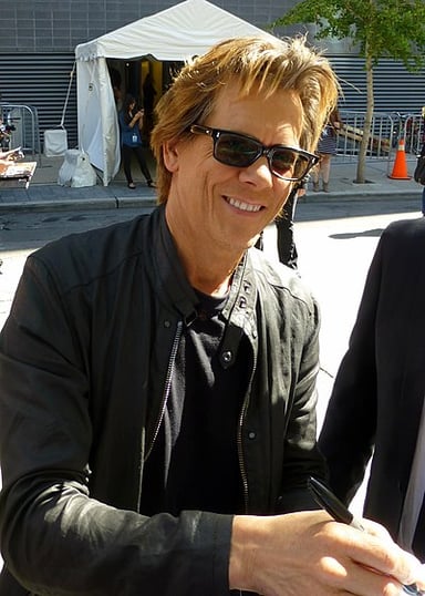 What does Kevin Bacon's charitable foundation SixDegrees.org deal with?