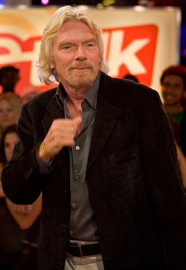 For what "services" was Richard Branson knighted in March 2000?