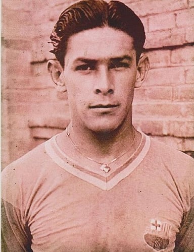 Which Alajuelense player later became the team's manager and led them to three national titles?