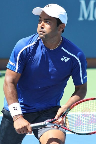 How many Davis Cup doubles wins does Leander Paes hold the record for?