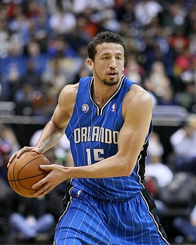 Who was the head coach of the Orlando Magic during Hedo's tenure in the team?