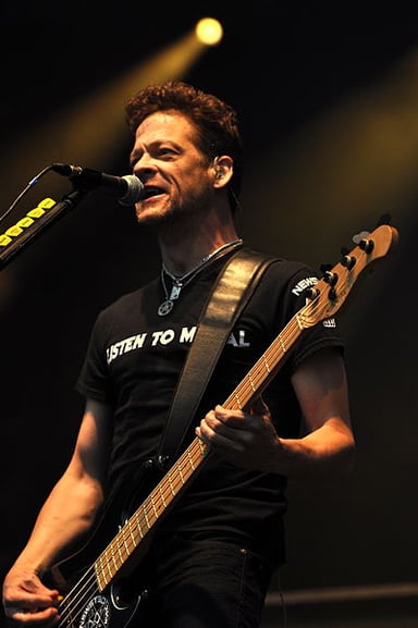 Before joining Metallica, which band did Newsted play for?