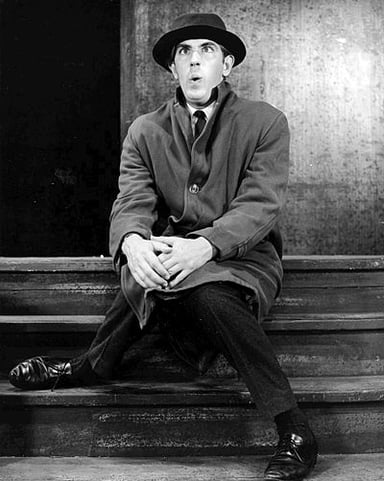 What genre of comedy was Peter Cook known for?