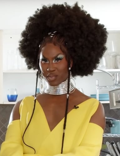 What type of garment is Shea Couleé best known for on the runway?