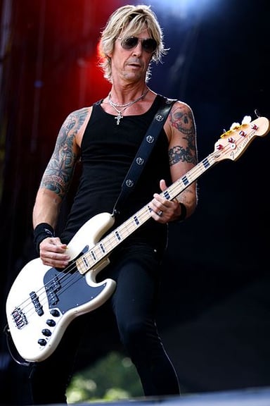 Which instrument does Duff McKagan primarily play?