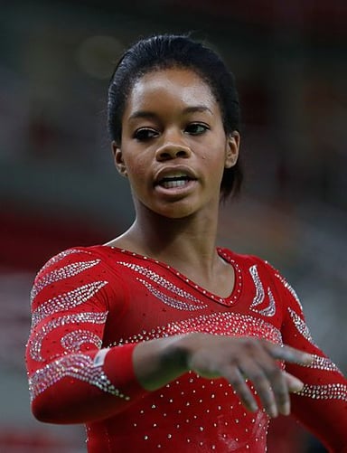 In what year did Gabby Douglas win a silver medal at the World Championships?