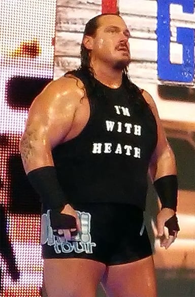 What ring name did Rhyno start his career with?