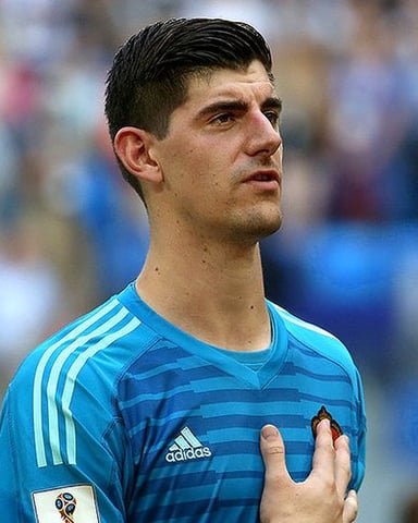 How old was Courtois when he made his senior debut?