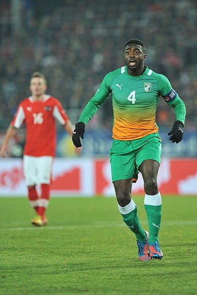 As of 2023, Kolo Touré is the African player with the most appearances in which league?