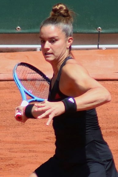 Against which player did Sakkari first make a top 5 win?