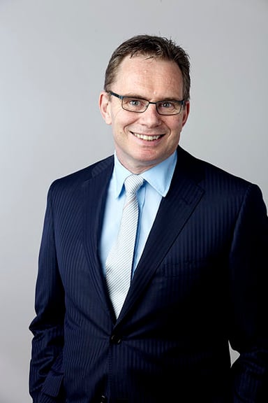 In which year did Andrew Mackenzie become the CEO of BHP Billiton?