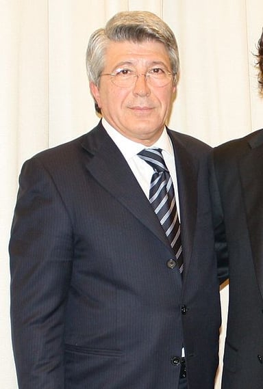 Which Spanish football club does Enrique Cerezo preside over?