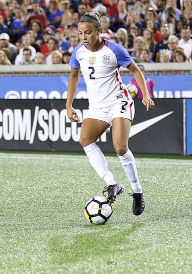 At what age did Swanson became the player with most assists in USWNT history?