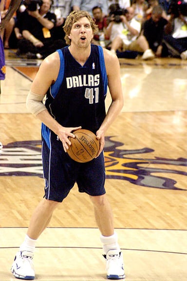 In which year was Dirk Nowitzki selected to the NBA 75th Anniversary Team?