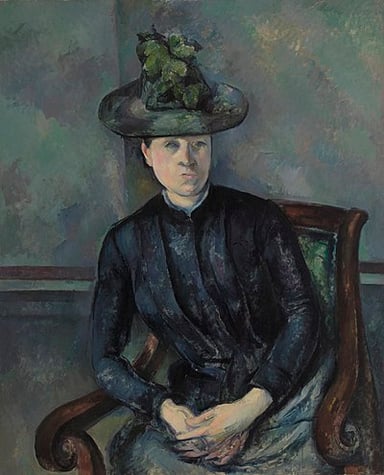 Which art critic organized a major retrospective of Cézanne's work in 1907?