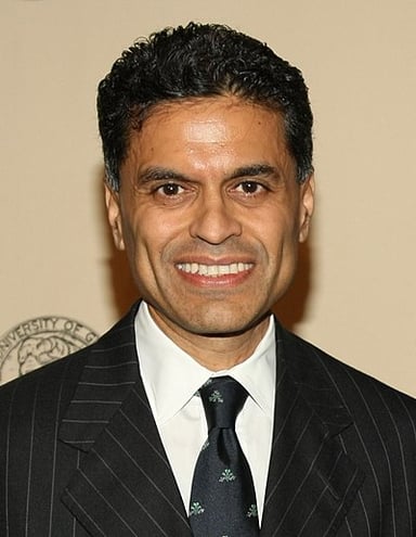 What genre does Fareed Zakaria primarily write in?