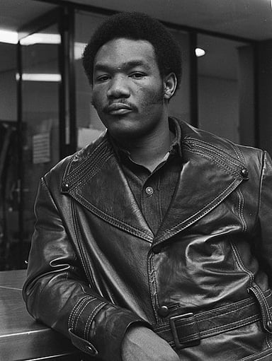 Did George Foreman compete in boxing after becoming an ordained Christian minister?
