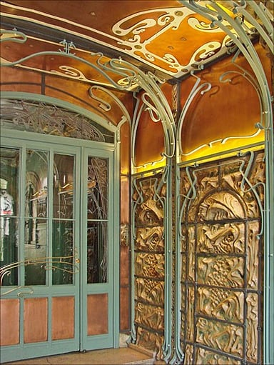 Did Guimard also design furniture and decorative works?