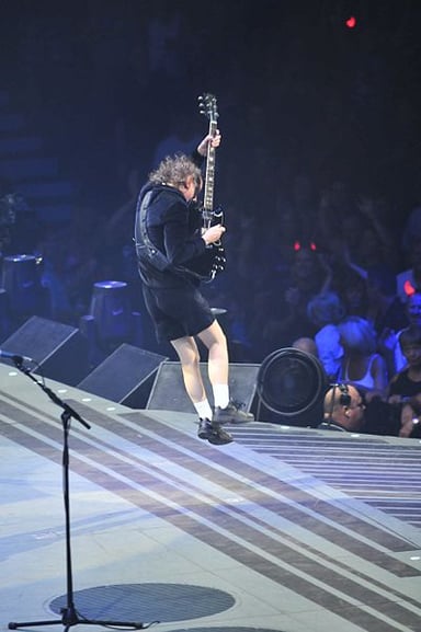 In what year was Angus Young inducted into the Rock and Roll Hall of Fame?