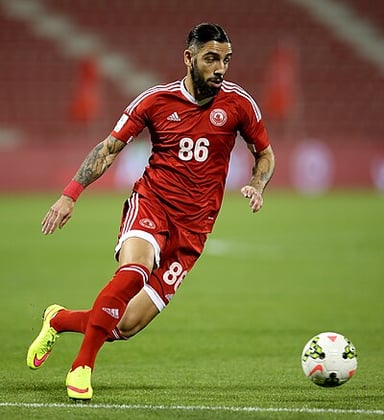 Which World Cup did Ashkan Dejagah help Iran qualify for but not play in?