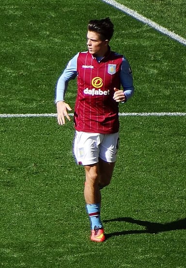 With which team did Grealish secure a continental treble in his second campaign?