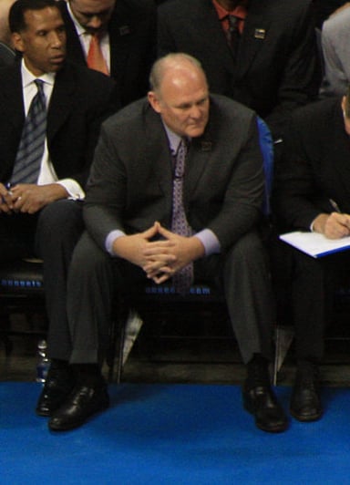 Which NBA team did George Karl play for during his playing career?