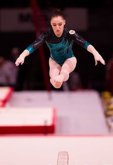 Who was the last gymnast to win an all-around medal in two consecutive Olympics before Mustafina?