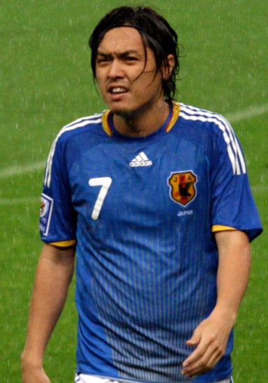 Who holds the record for the most caps in the history of Japanese male footballers?