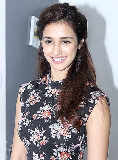 Which actor starred opposite Disha in'Baaghi 2'?