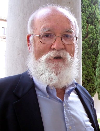 Does Dennett's research relate to evolutionary biology?