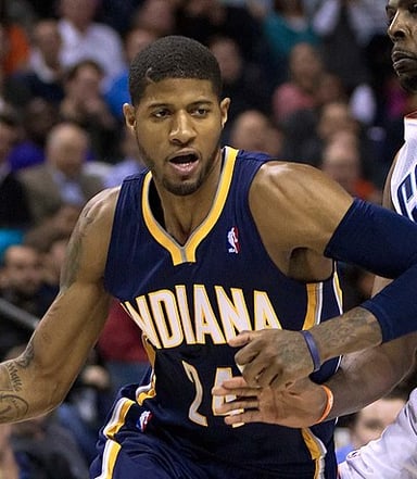 For which national team did Paul George break his leg in 2014?