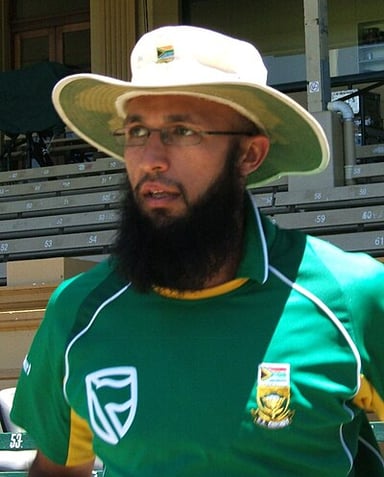 Against which country did Hashim Amla score his highest test score?