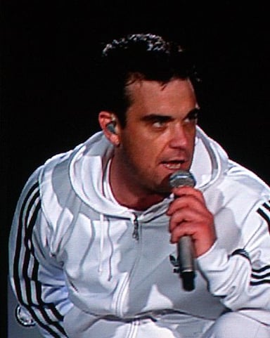 Robbie Williams plays for or had played for what sport team?