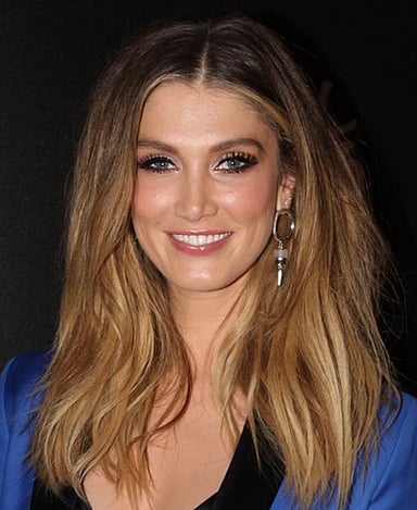 In which year did Delta Goodrem coach the eventual winner on The Voice Kids?