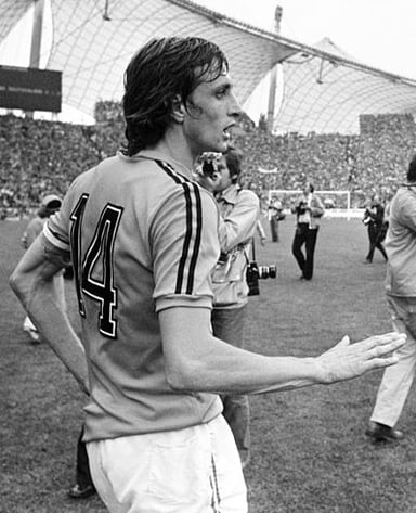 In what year did Johan Cruyff retire from playing football?