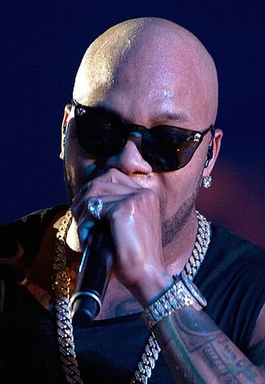 Which artist featured in Flo Rida's "Low"?