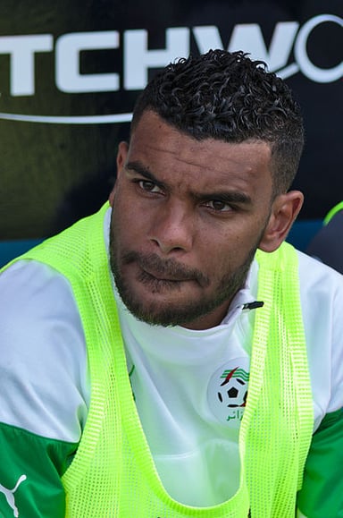 What is the striking feature of Soudani's hairstyle?