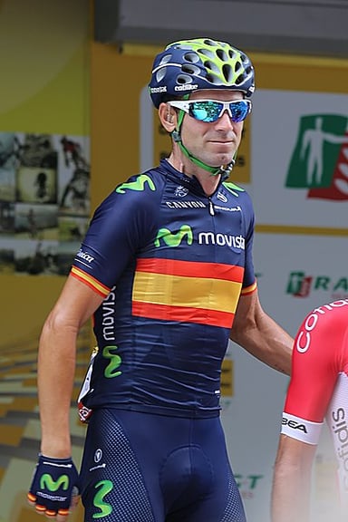 How many professional victories did Alejandro Valverde secure during his road racing career?