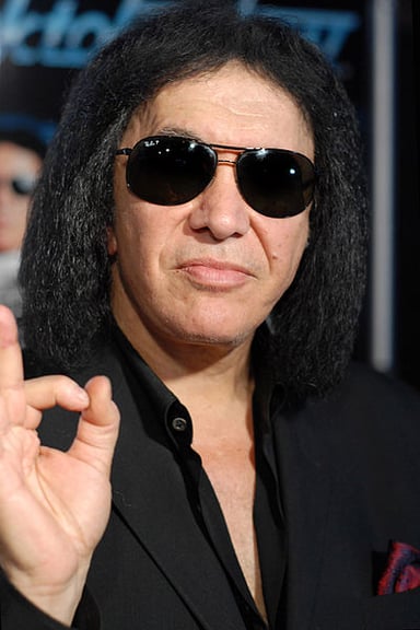 What is the main theme of Gene Simmons' stage persona?