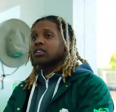 Which record company did Lil Durk sign with, post his departure from Def Jam Recordings?