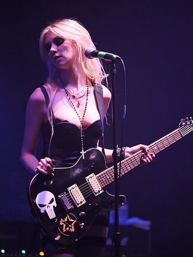 What rock band is Taylor Momsen the frontwoman of?