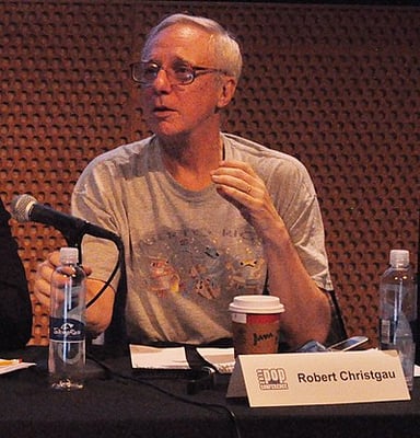 In what decade did Christgau start his career as a professional rock critic?