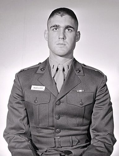 For which war did Mueller serve as a Marine Corps officer?