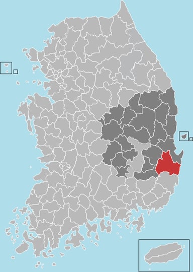 In which year did Gyeongju city unite with the nearby rural Gyeongju County?