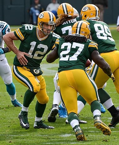 What is Aaron Rodgers' career touchdown-to-interception ratio in the regular season?