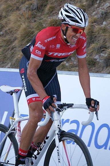 In which Grand Tour did Contador complete his set of titles?