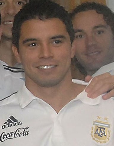 Which position did Saviola play at Barcelona and Real Madrid?
