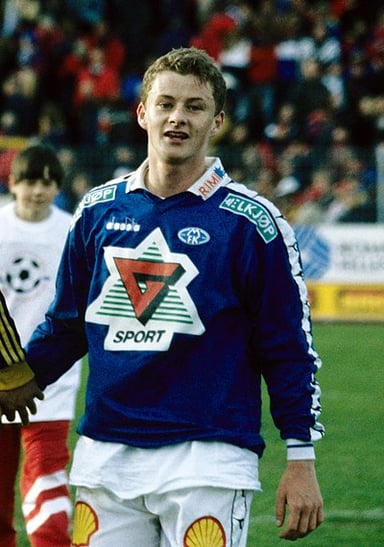 In which year did Molde FK first play in the top division of Norwegian football?