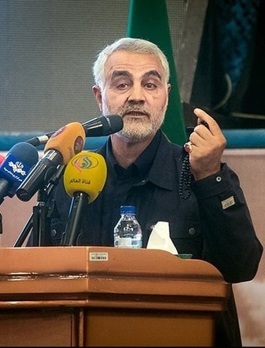 In which war did Qasem Soleimani first assemble and lead a company of soldiers?